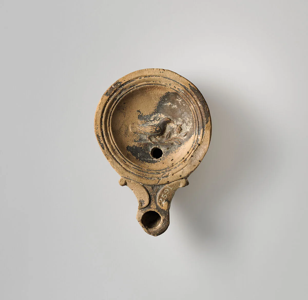 Terracotta oil lamp — Unknown
