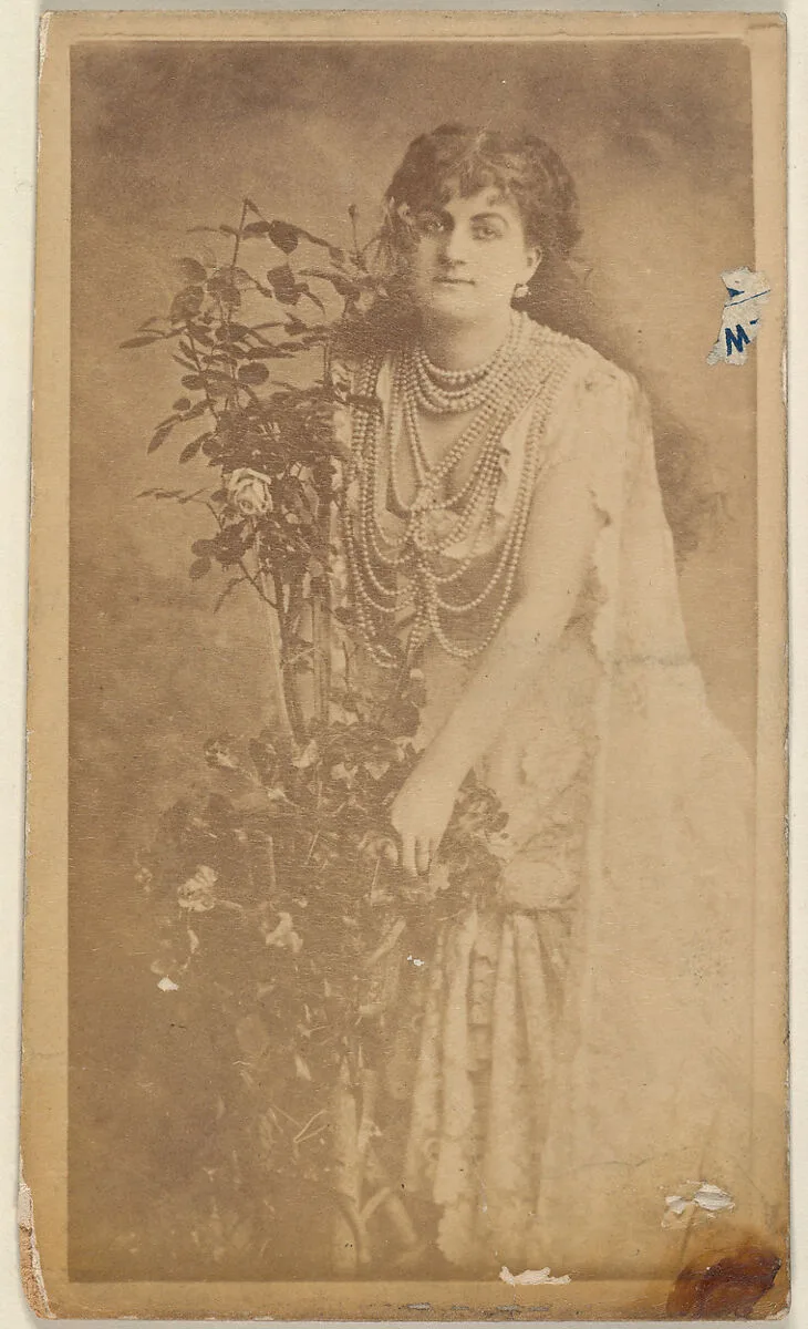 Actress holding floral vines, from the Actresses series (N668) — Unknown