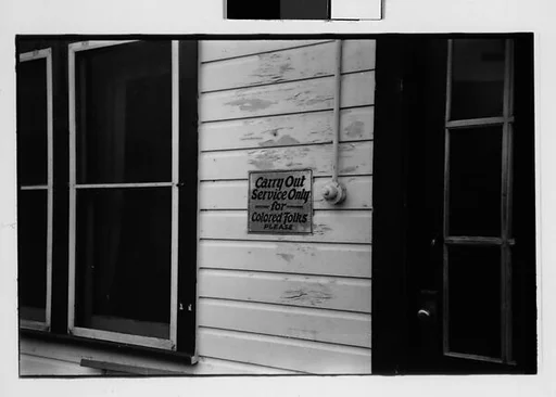 [One 35mm Film Frame: Segregation Sign on Wall, Illinois?]