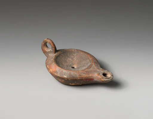 Terracotta oil lamp