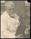 Frank Eugene Holding His Dachshund — Unknown