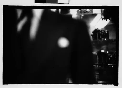 [Five 35mm Film Frames: Camera Store Window, Subway Passengers, New York City]
