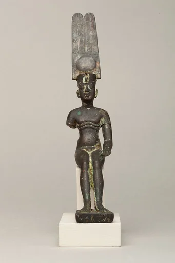 Child god wearing Amonian crown and named Horus of Mednit (Aphroditopolis)