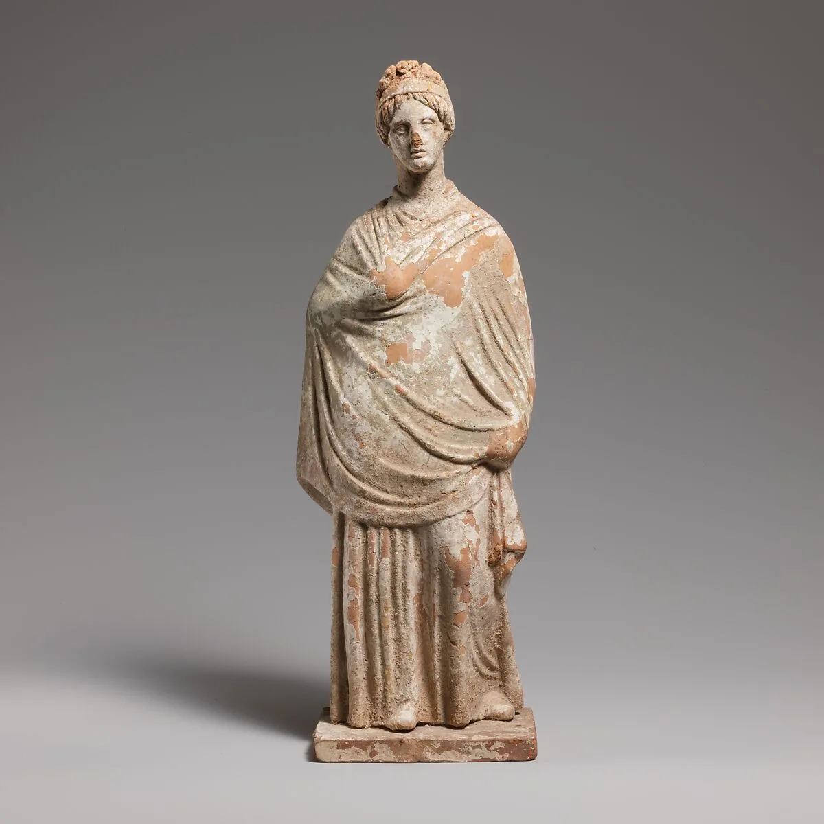 Terracotta statuette of a standing woman — Unknown