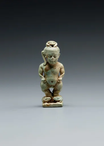 Amulet: Pataikos astride crocodiles and with a scarab on his head