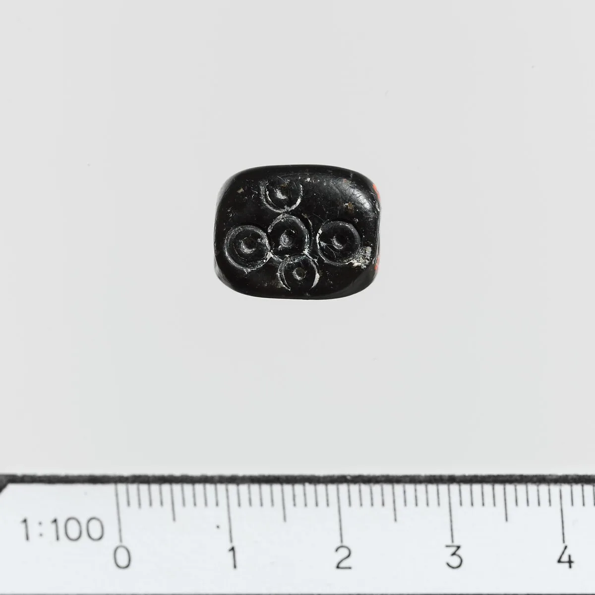 Serpentine triangular prism with circles — Unknown