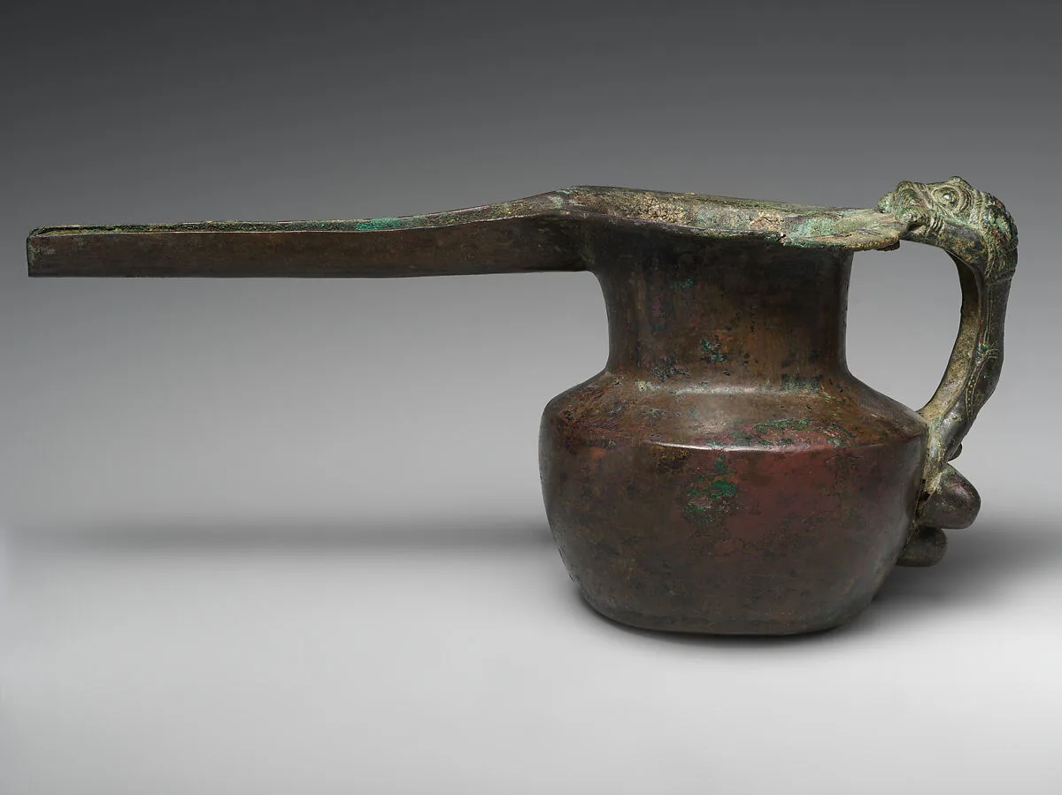 Spouted vessel with lion-shaped handle — Unknown