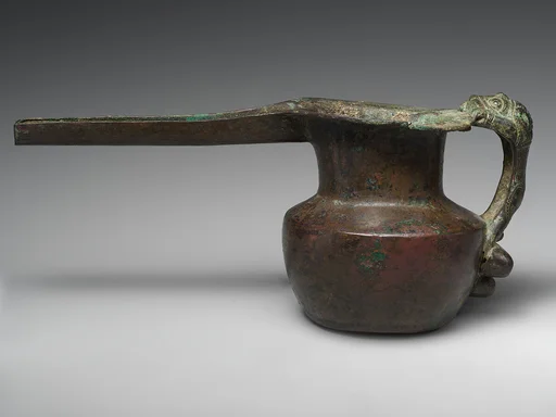 Spouted vessel with lion-shaped handle