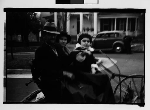 [Man and Two Young Women in Horse-Drawn Carriage, Milledgeville, Georgia]