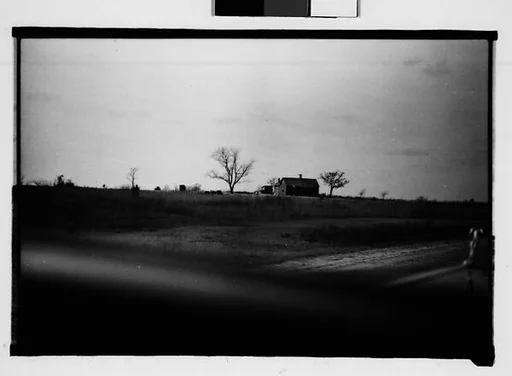[Wooden House in Field, From Moving Automobile, Macon, Georgia]