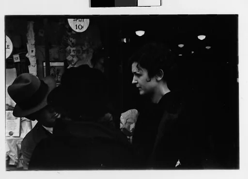 [Two 35mm Film Frames: Man and Two Women in Conversation on Street Outside Newberry's, New York City?]