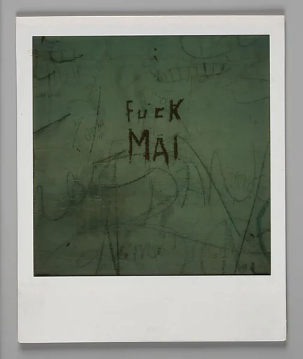[Graffiti: "Fuck Mai"]