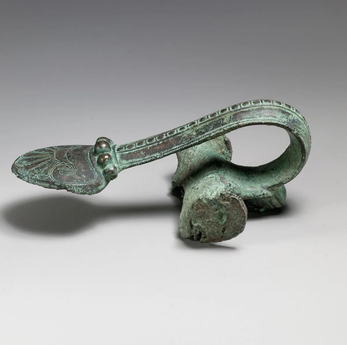 Bronze handle of an oinochoe (jug) — Unknown