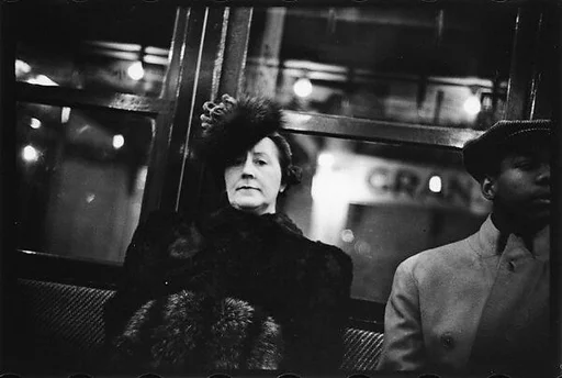 [Five 35mm Film Frames: Subway Passengers, Times Square Shuttle, New York City: Woman in Fur Hat and Coat, Man in Cap, Women in Hats]