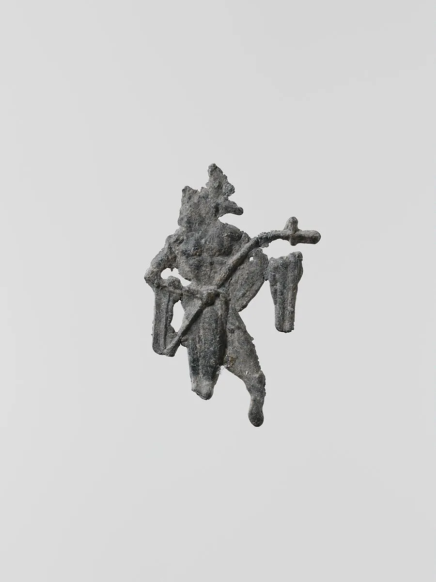 Lead figure of a man with a spear or scepter — Unknown
