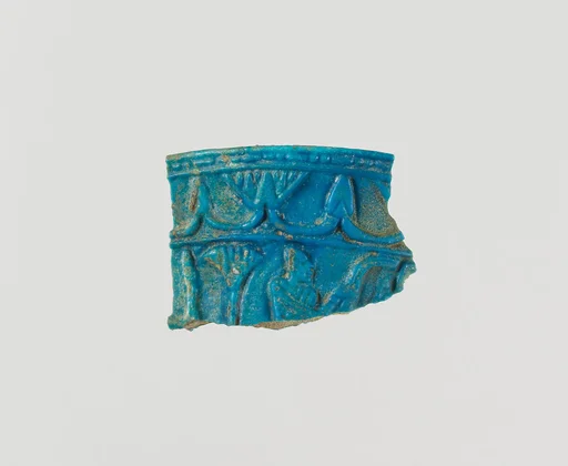 Chalice rim fragment with floral chain and scene of man in papyrus