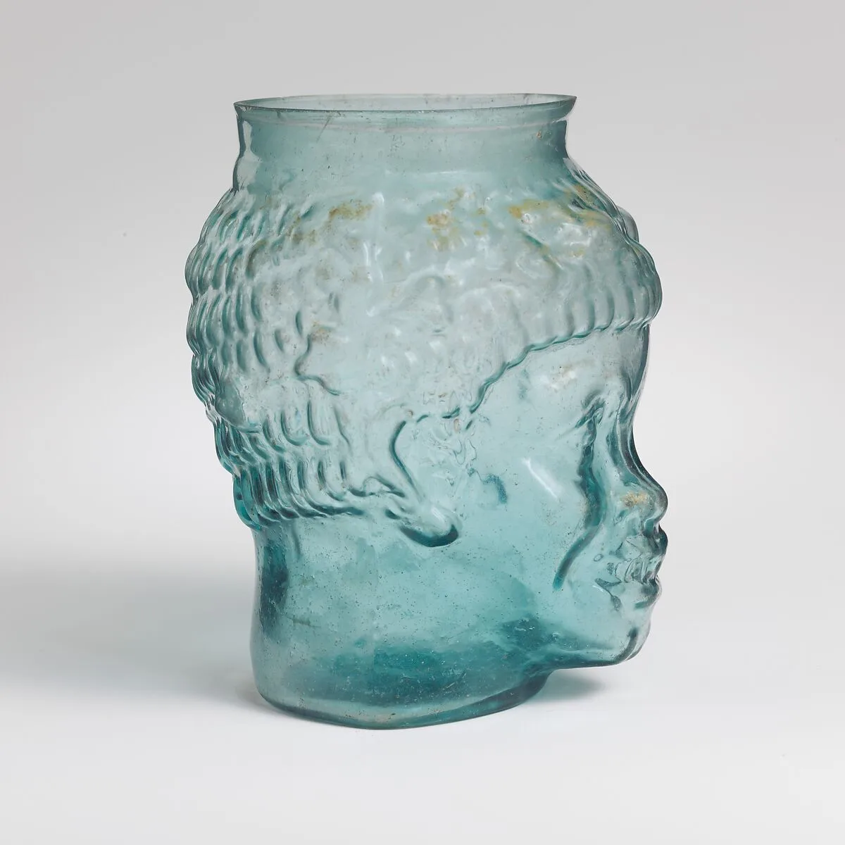 Glass cup in the form of the head of a Black African — Unknown