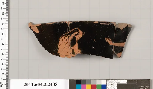 Terracotta fragment of a head kantharos (drinking cup with high handles)?