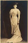[Woman Standing in Evening Dress]
