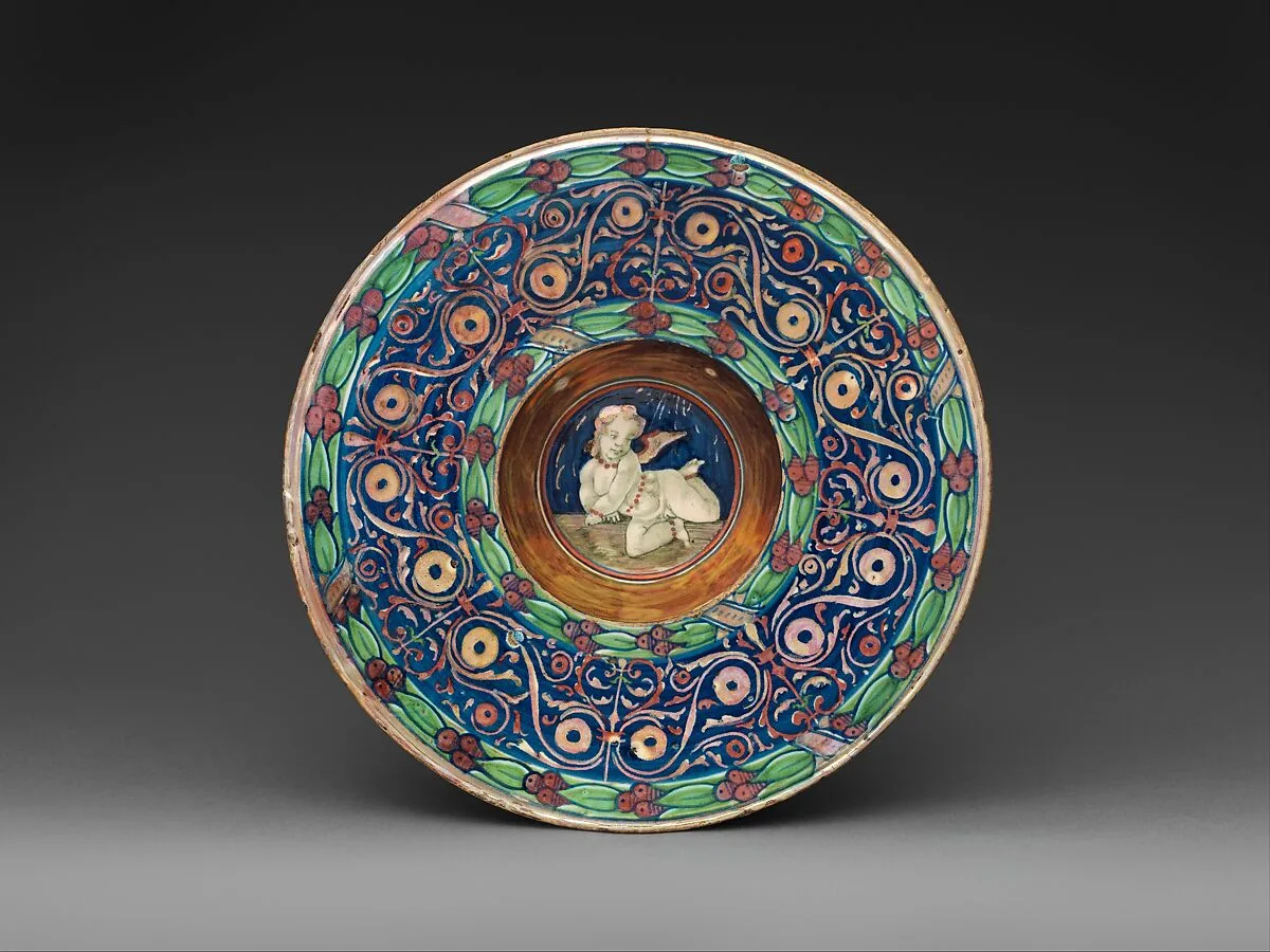 Wide-rimmed bowl with winged putto — Maestro Giorgio Andreoli