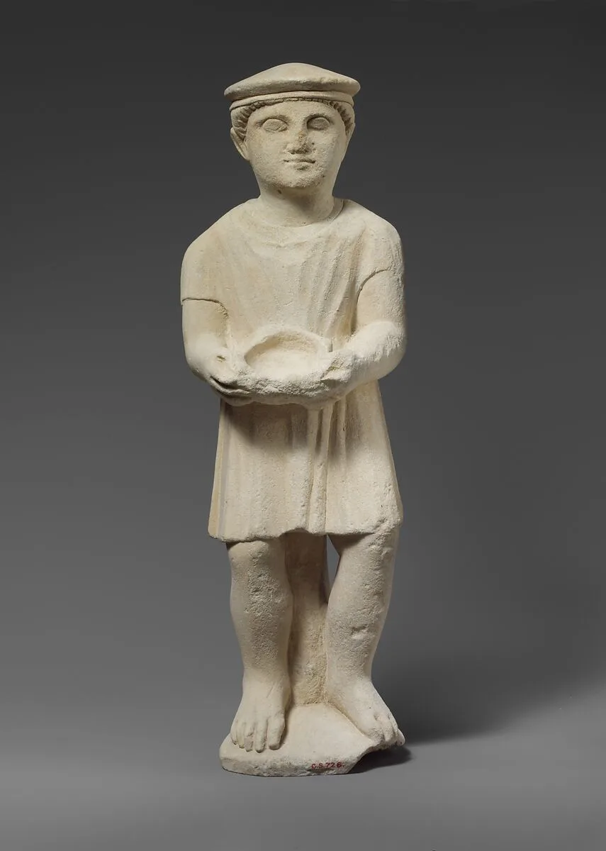 Limestone statuette of a boy with a kausia — Unknown