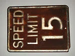 [Rusted Metal Sign: "Speed Limit 15"]