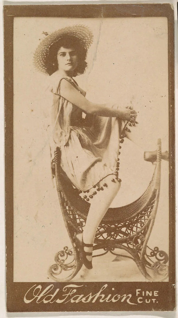 Actress perched on elaborate chair, from the Actresses series (N664) promoting Old Fashion Fine Cut Tobacco — Unknown