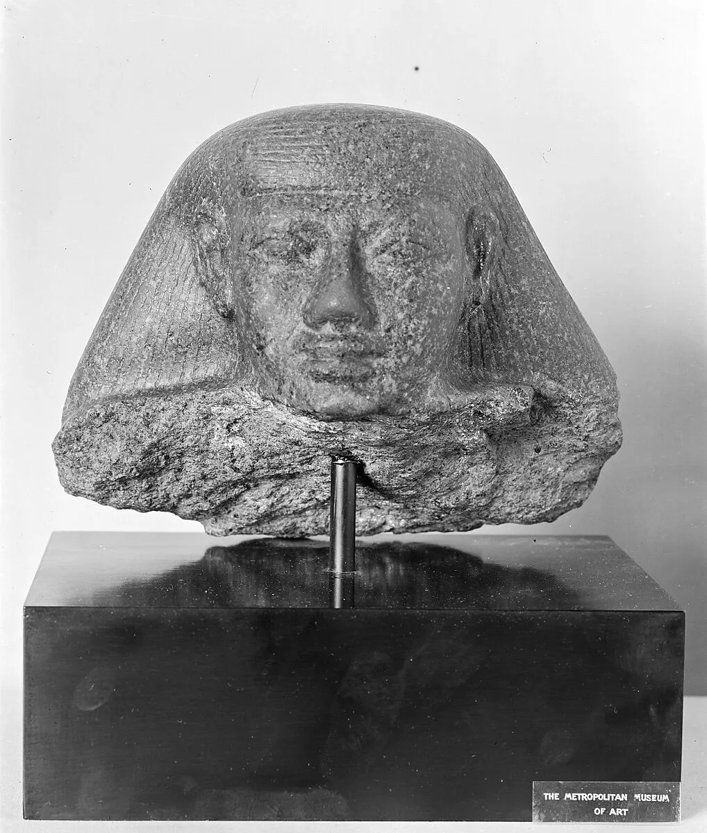 Head from a Block Statue of Mentuhotep, lower part in the University of Tubingen museum — Unknown
