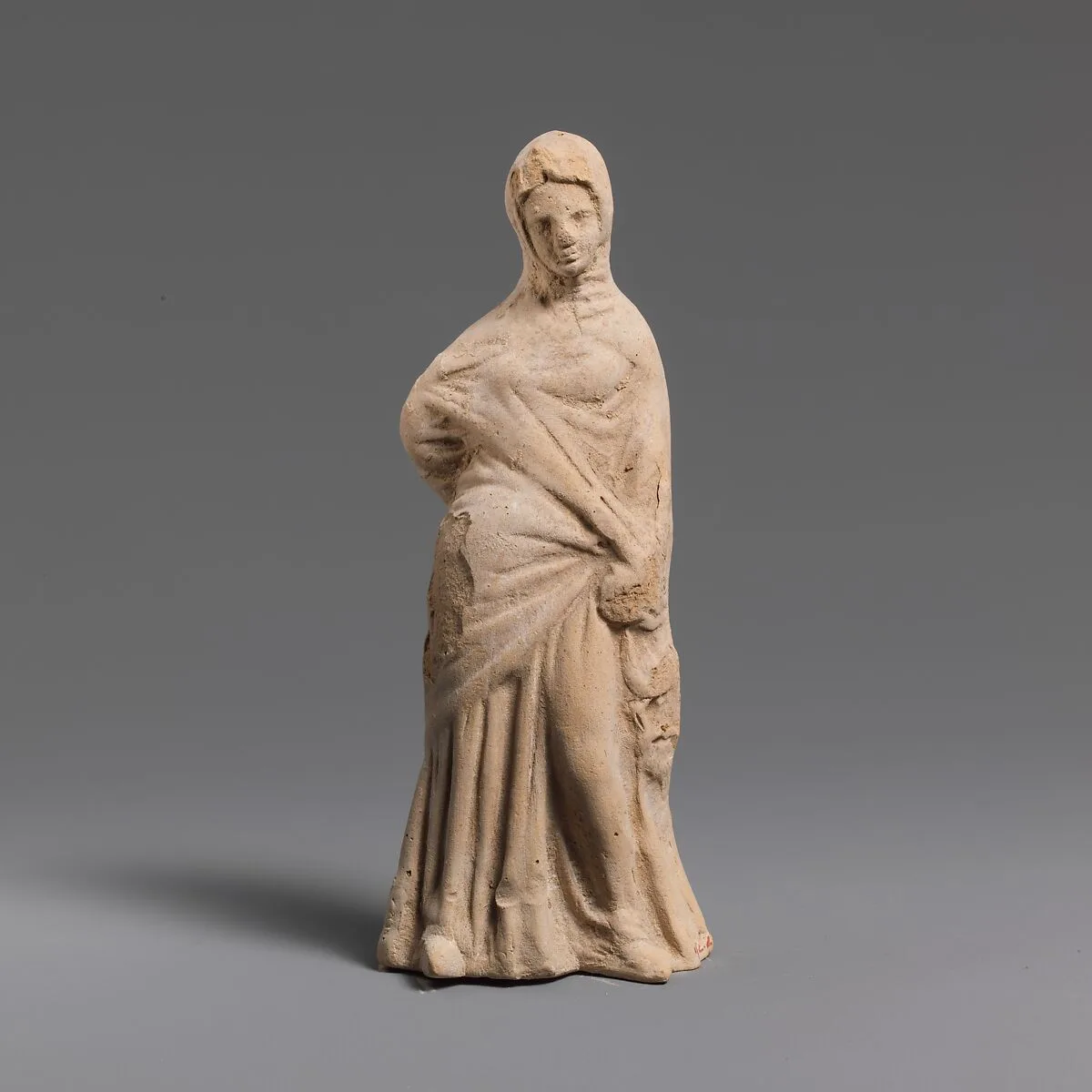 Terracotta statuette of a woman — Unknown