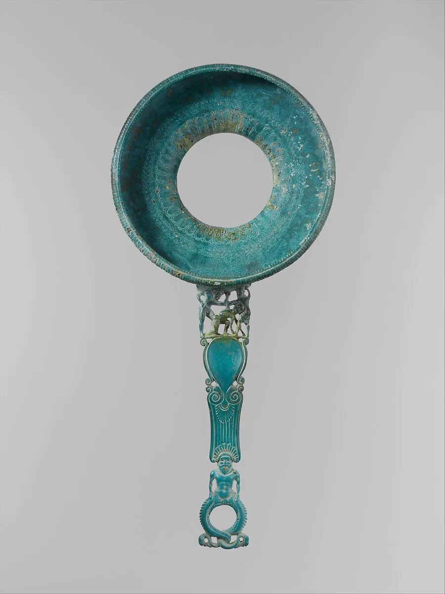 Bronze strainer with openwork handle — Unknown