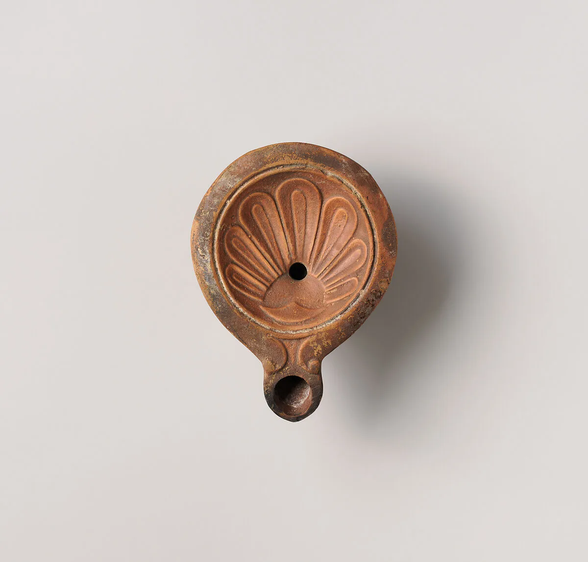 Terracotta oil lamp — Unknown
