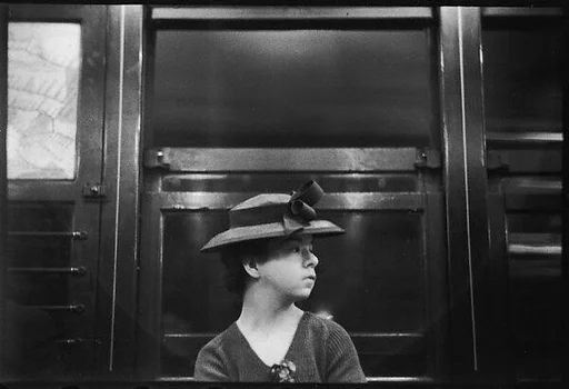 [Four 35mm Film Frames: Subway Passengers, New York City: Girl in Bonnet, Woman Reading Newspaper]
