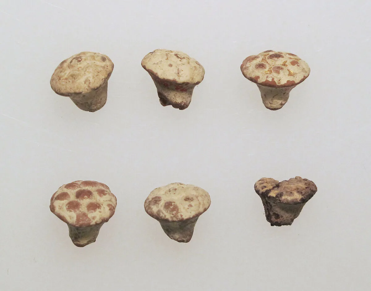 Pendant of gilded clay — Unknown
