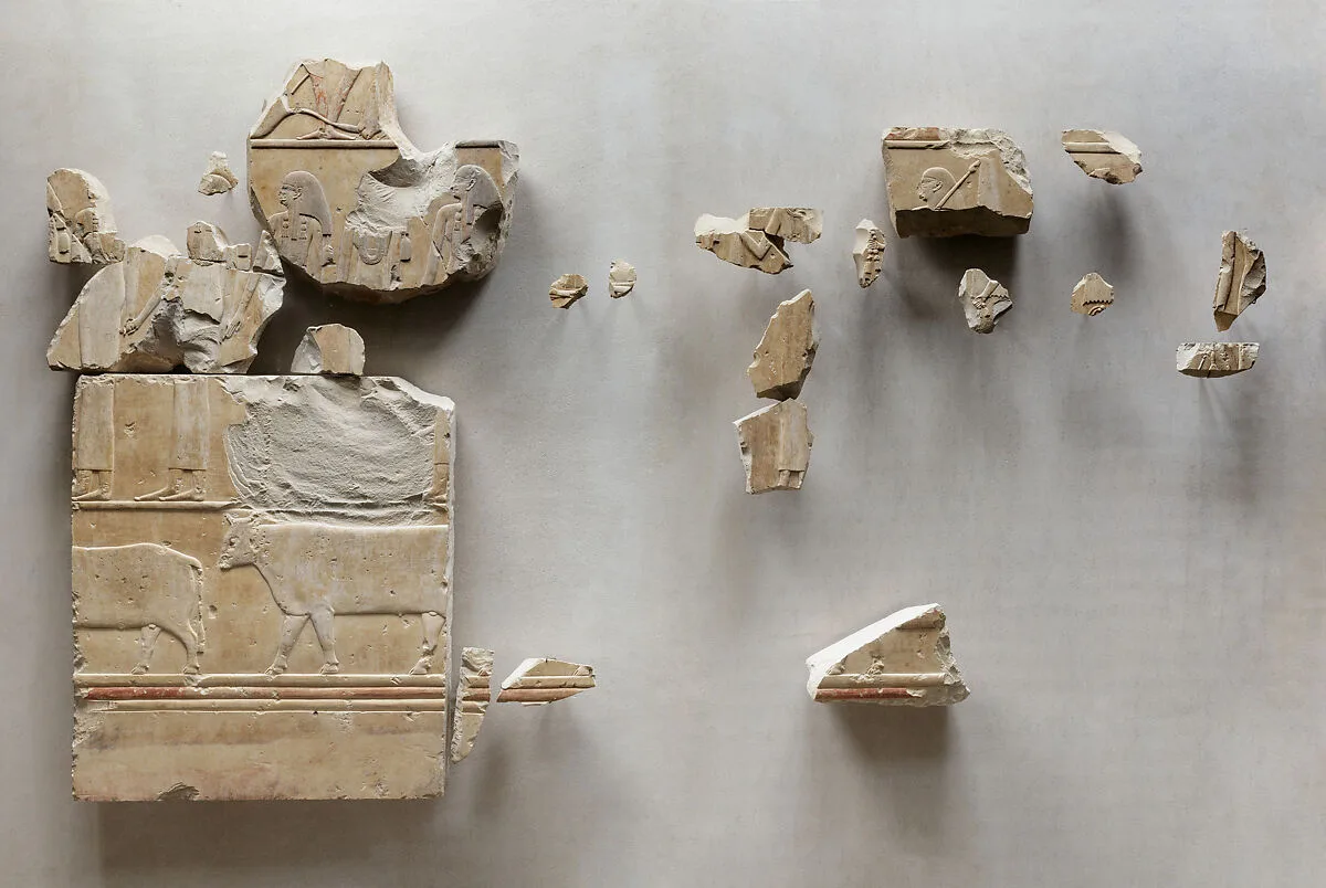 Relief fragments from the tomb of Neferu showing richly adorned attendants moving right to left — Unknown