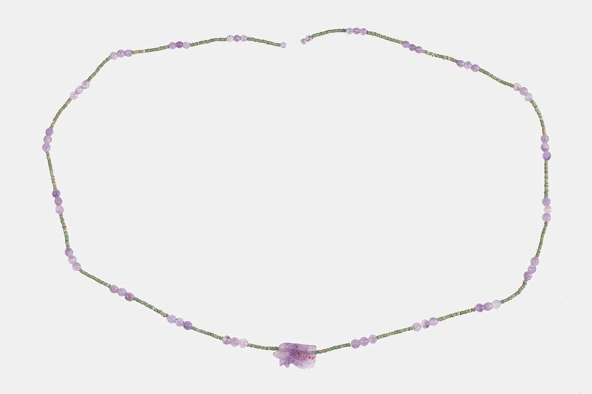 String of 63 ball beads and 1 wedjat amulet of Hepy — Unknown