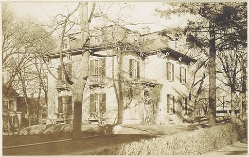 [Victorian Architecture: Rear View of Three Story House with Mansard Roof]