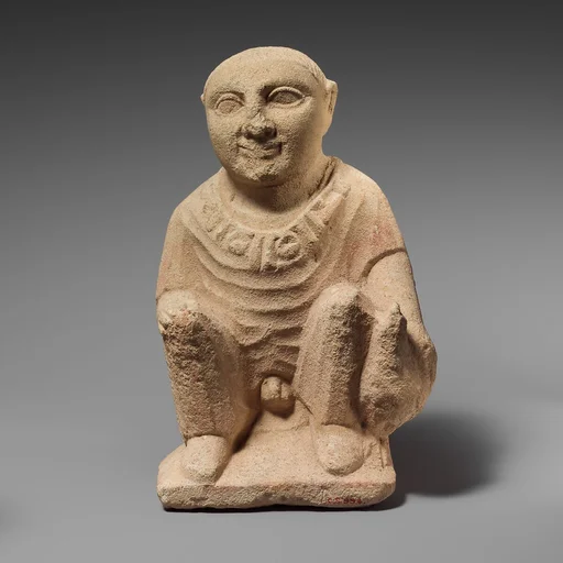Limestone statuette of a temple boy