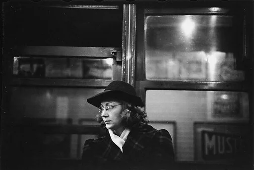 [Five 35mm Film Frames: Subway Passengers, New York City: Woman in Hat and Scarf, Older Woman and Girl, Woman in Headscarf, Man in Hat Holding Newspaper]