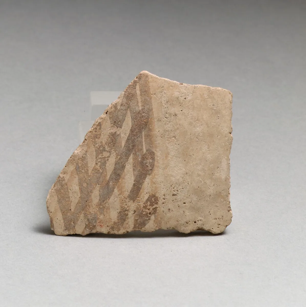 Terracotta vessel fragment with cross-hatched design — Unknown