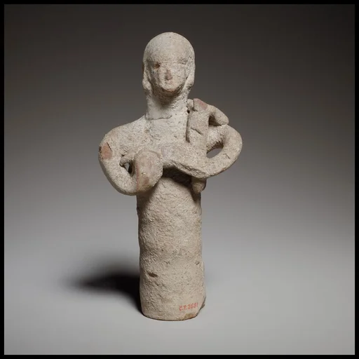Standing figurine holding a quadruped
