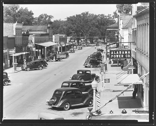 [Main Street with Parked Cars and Alabama Power Company Sign, From Elevated Position, Greensboro, Alabama]
