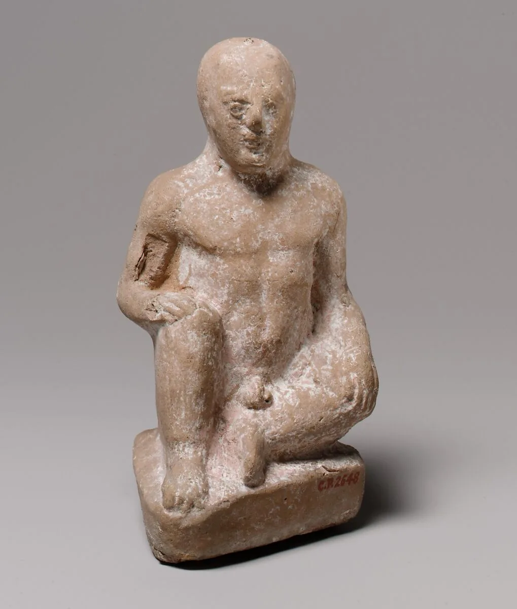 Terracotta statuette of a seated boy — Unknown