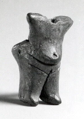 Standing female (with a hole for attachment of the head, now missing)