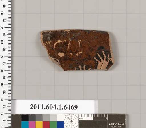Terracotta rim fragment of a kylix (drinking cup)