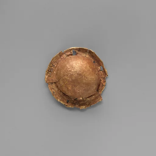 Gold roundel of bulbous form