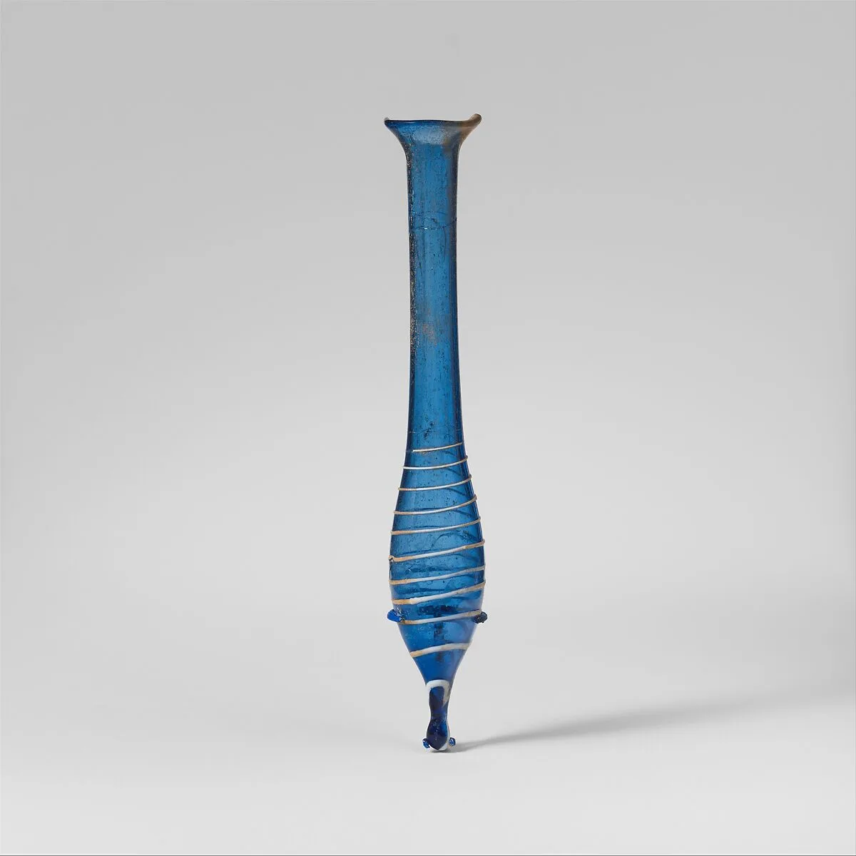 Glass perfume bottle with opaque white trail — Unknown