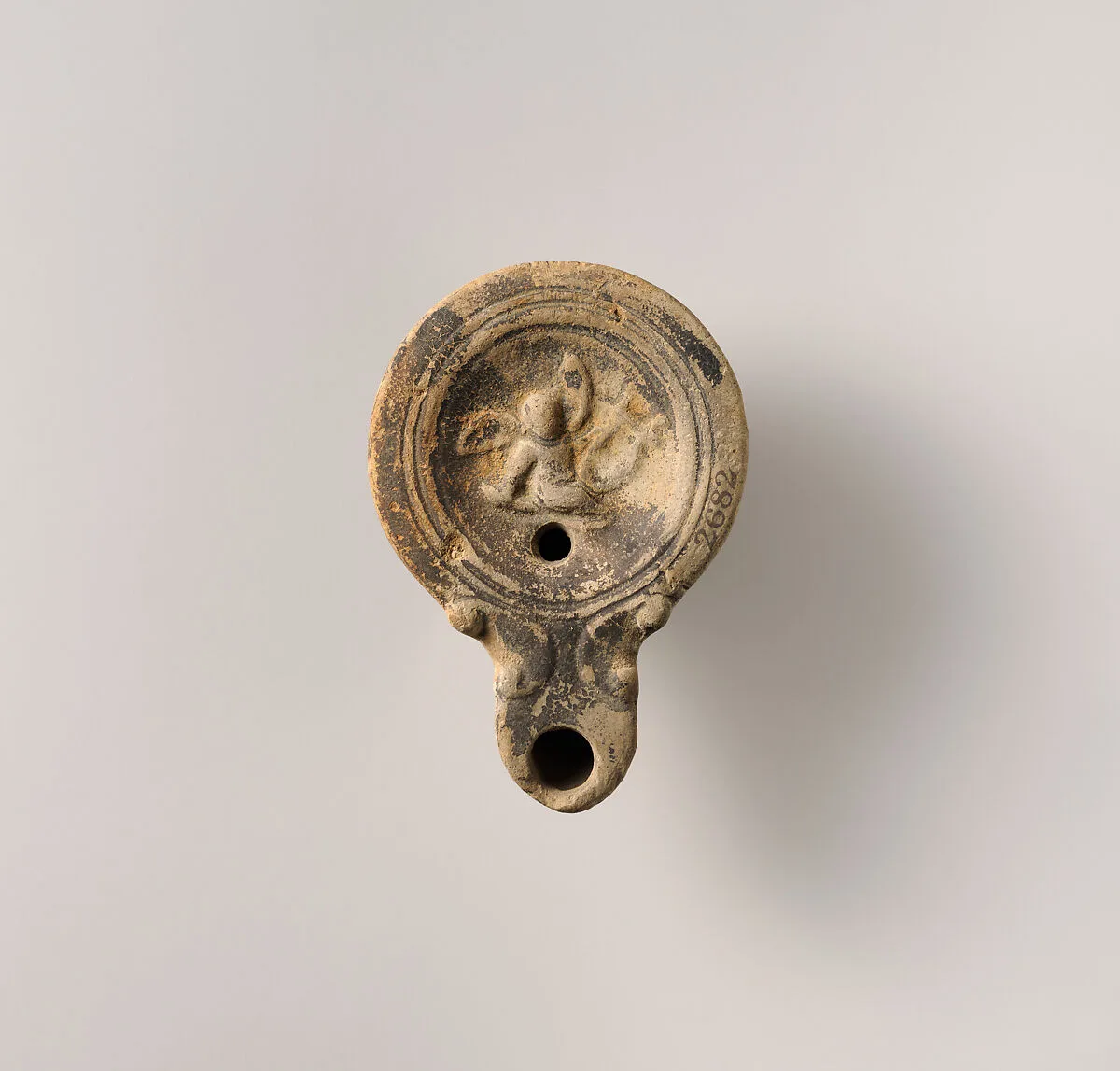 Terracotta oil lamp — Unknown