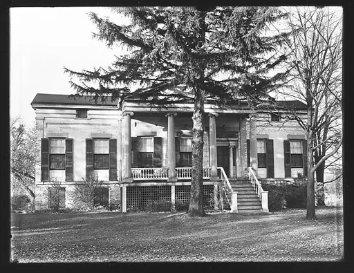 [Brick Greek Revival House with Pine Tree in Front, New York]