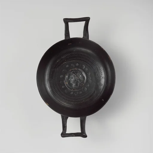 Terracotta stemless kylix (drinking cup)