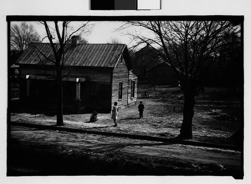 [Wooden House with Children in Yard, From Moving Train, Savannah, Georgia]